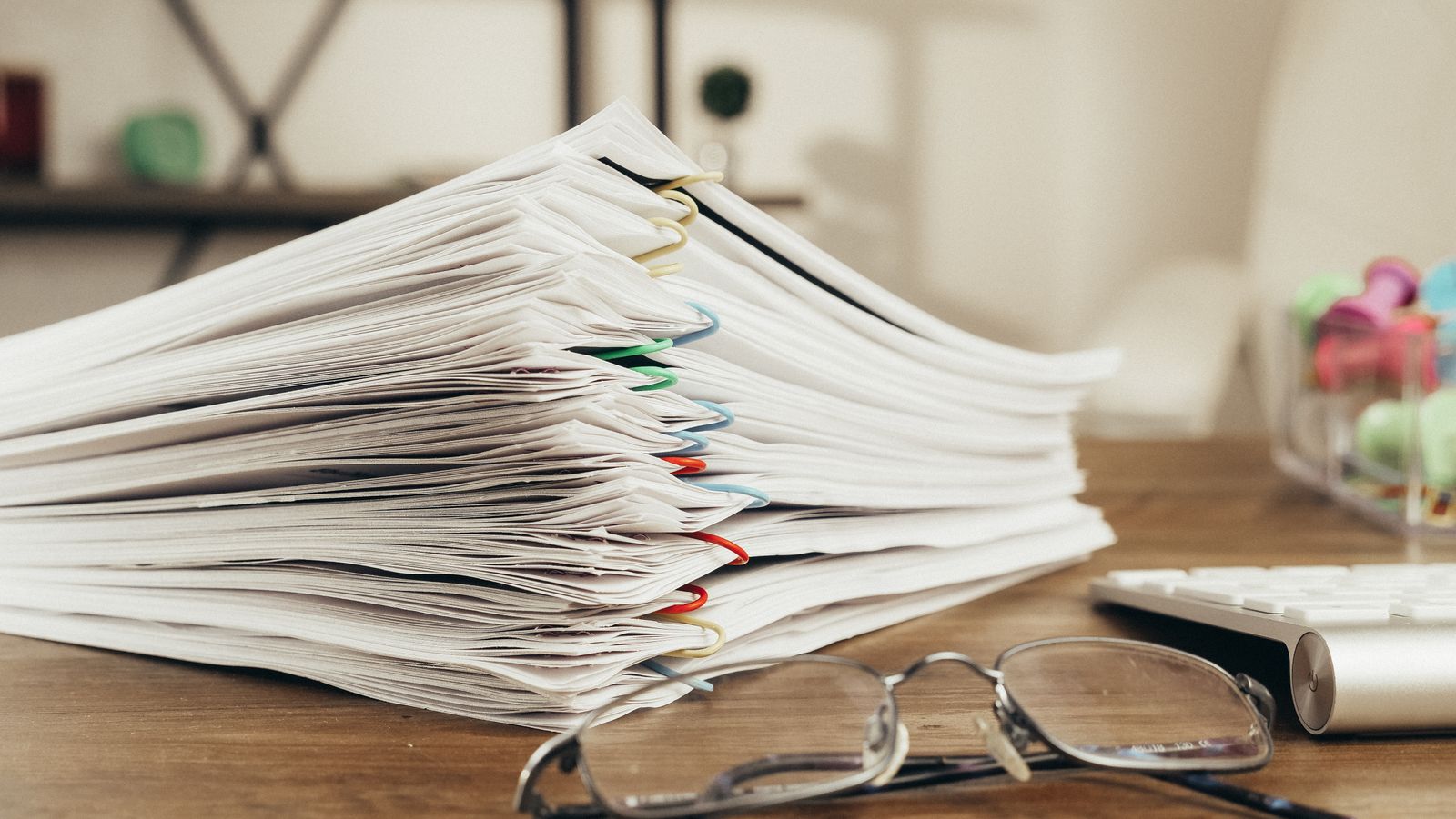 A stack of paper enquiries waiting to be worked through