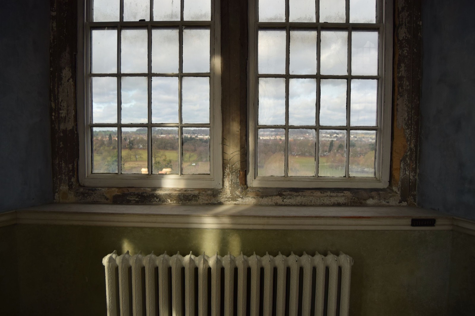 An empty period room with sash windows