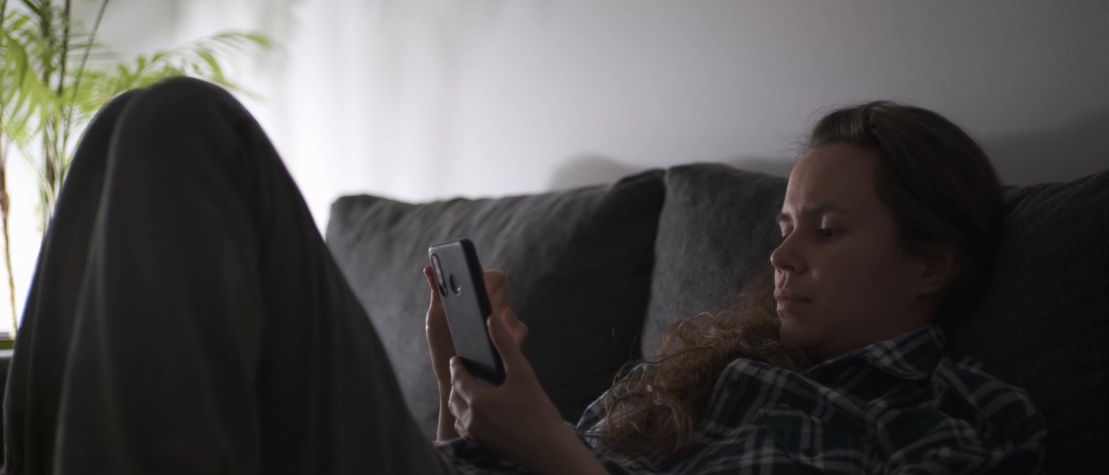 Someone browsing property listings at home in the evening