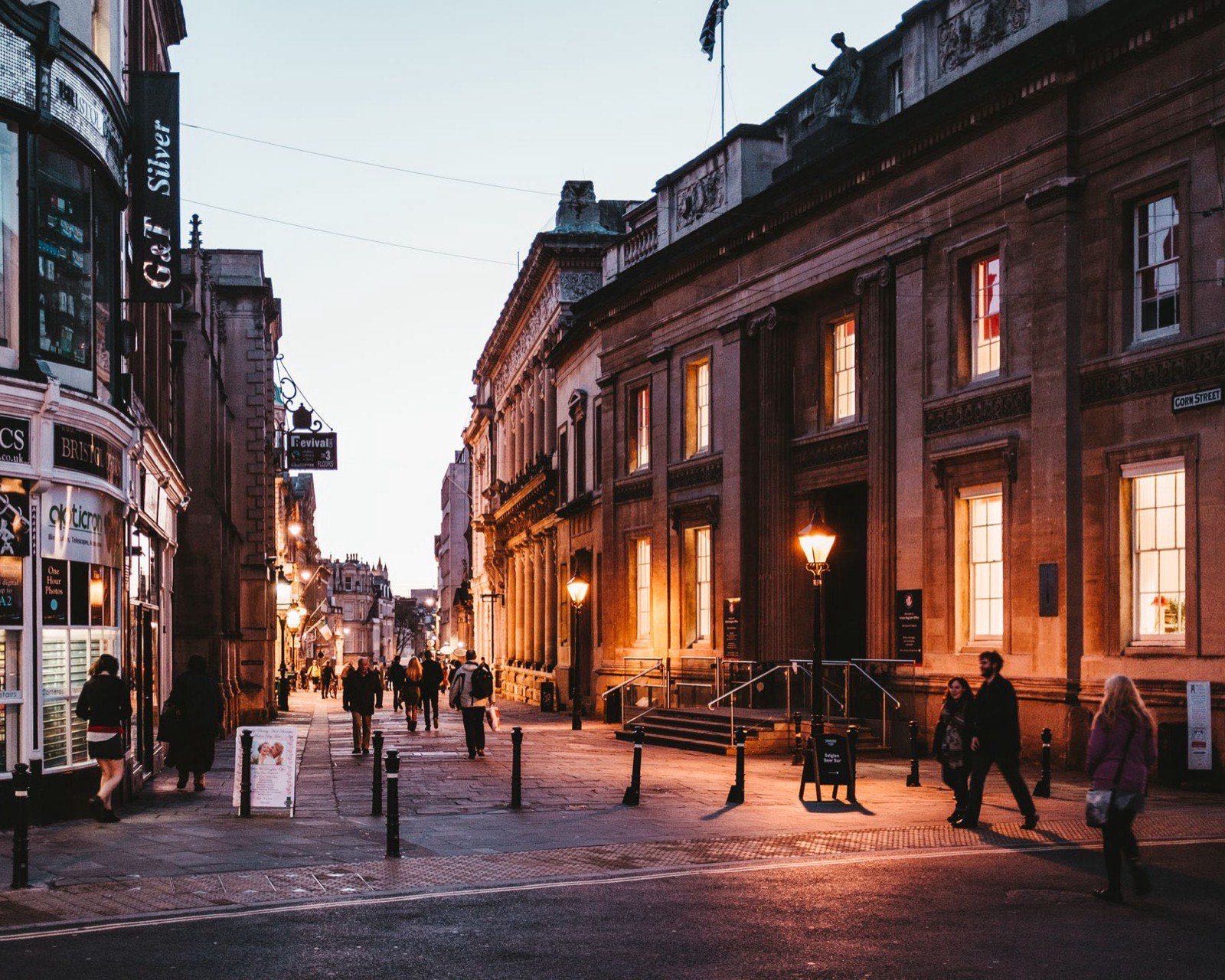 A UK high street with the lights still on after closing