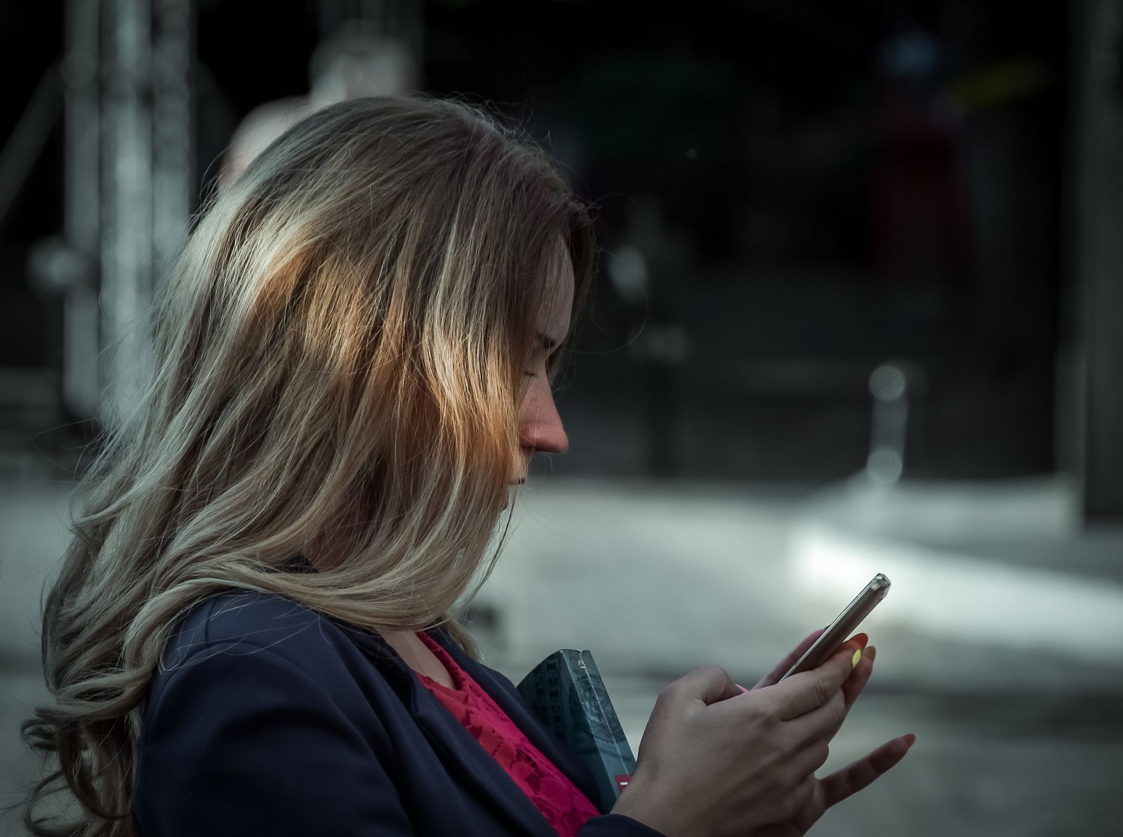 A woman typing a message on her phone